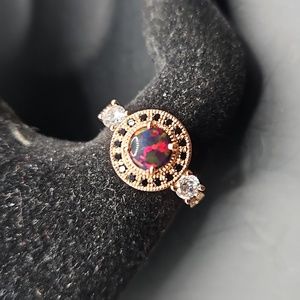 G-6 Rosegold tone ring with red and clear stones